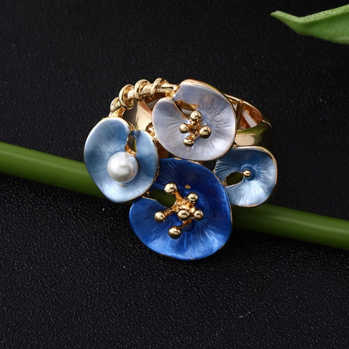 Anello dichiarativo regolabile con perle floreali blu